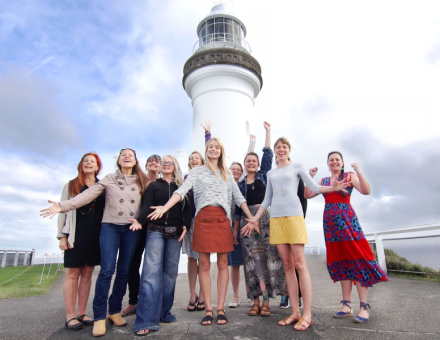 group in front of Byron Bay lighthouse